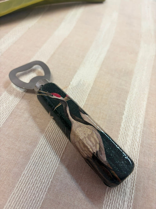 Abridor Pájaro Negro